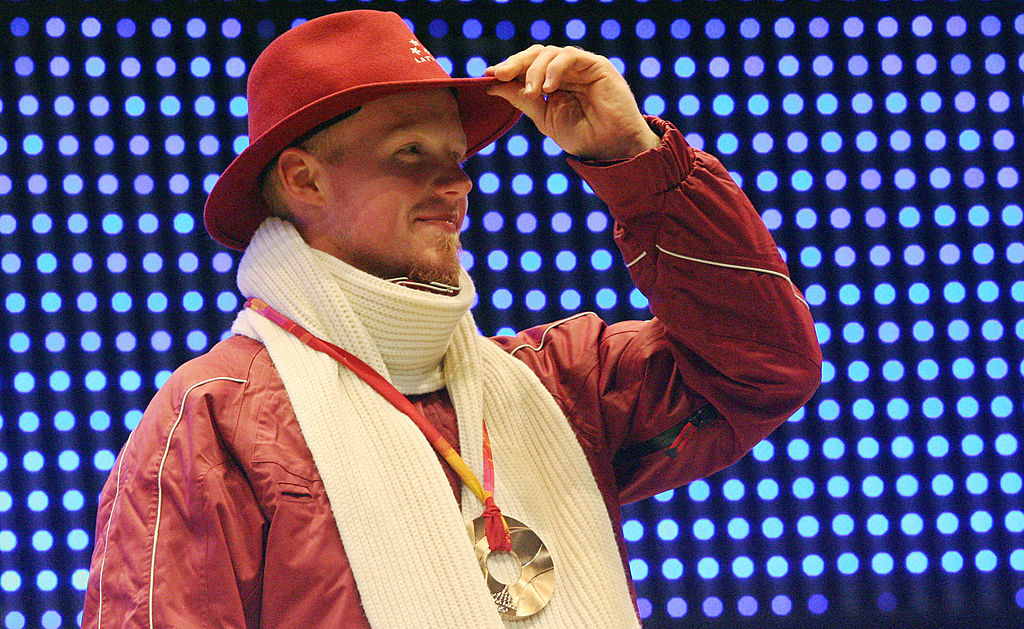 Bronze medallist Latvia's Martins Rubenis celebrates during a 2006 Winter Olympics medal ceremony in Turin, 13 February 2006. (THOMAS COEX/AFP/Getty Images)