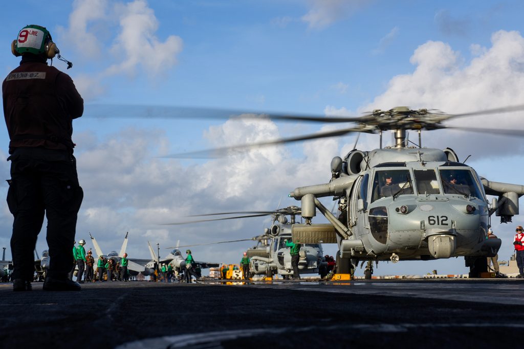 MH-60 Sea Hawk helicopters assigned to Helicopter Sea Combat Squadron (HSC) 6 and Helicopter Maritime Strike Squadron (HSM) 73 perform pre-flight checks aboard the aircraft carrier USS Theodore Roosevelt (U.S. Navy photo by Mass Communication Specialist 3rd Class Anthony J. Rivera)