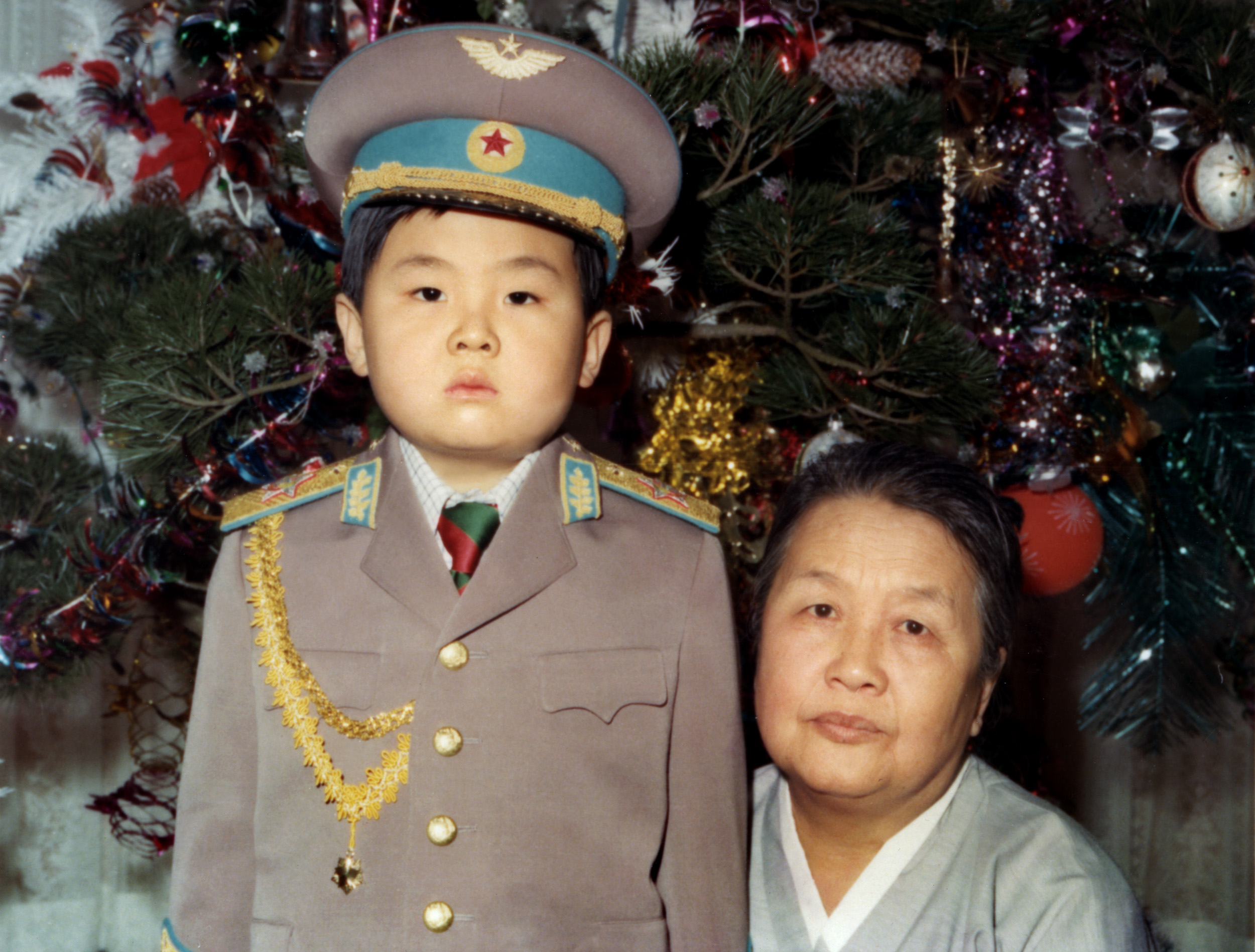 Kim Jong-Nam dressed in an army uniform poses with his maternal grandmother in January 1975 in an unknown place. (AFP/Getty Images)