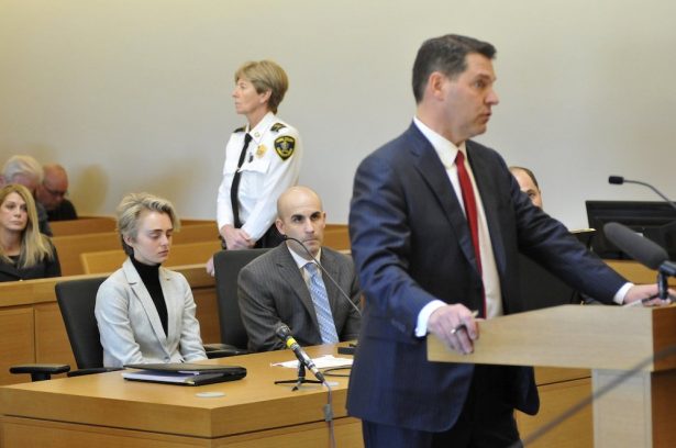 Michelle Carter, 22, second (L), appears in Taunton District Court in Taunton, Mass., on Feb.11, 2019 for a hearing on her prison sentence as lawyer Joe Cataldo speaks at the podium. (Mark Stockwell/The Sun Chronicle via AP)