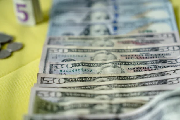 U.S. bank notes and coins. (Madalina Vasiliu/The Epoch Times)