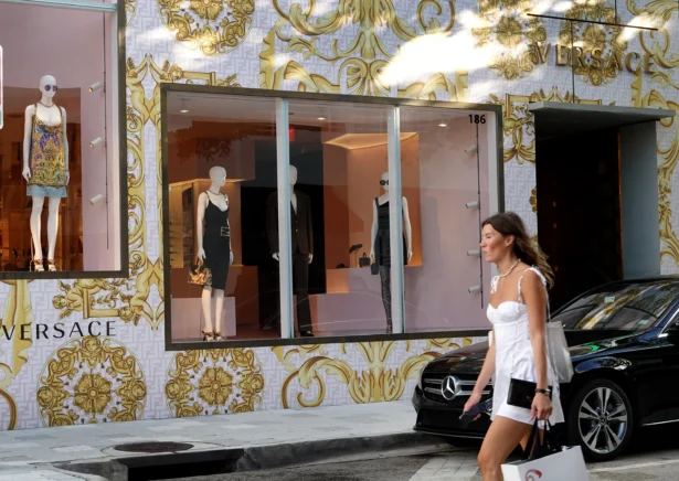 A person walks past the Versace store in the Design District neighborhood of Miami on July 15, 2022. (Joe Raedle/Getty Images)