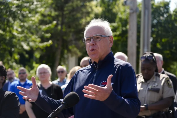 Minnesota Gov. Tim Walz, who announced on Jan. 5, 2026, that he would not seek re-election, speaks outside the Annunciation Catholic School in Minneapolis on Aug. 27, 2025. (Bruce Kluckhohn/AP Photo)