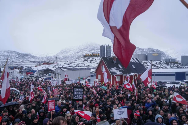 People hold a protest against President Donald Trump's goal of the United States acquiring Greenland, in front of the U.S. Consulate in Nuuk, Greenland, on Jan. 17, 2026. (AP Photo/Evgeniy Maloletka)