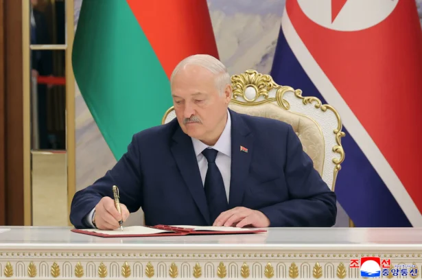 In this photo provided by the North Korean government, Belarusian President Alexander Lukashenko signs a document in Pyongyang, North Korea, on March 26, 2026. (Korean Central News Agency/Korea News Service via AP)