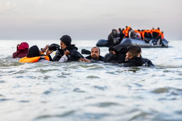 Illegal immigrants fail to board a smuggler's boat in an attempt to cross the English Channel off the beach of Gravelines, northern France, on Aug. 12, 2025. (Sameer Al-Doumy/AFP)