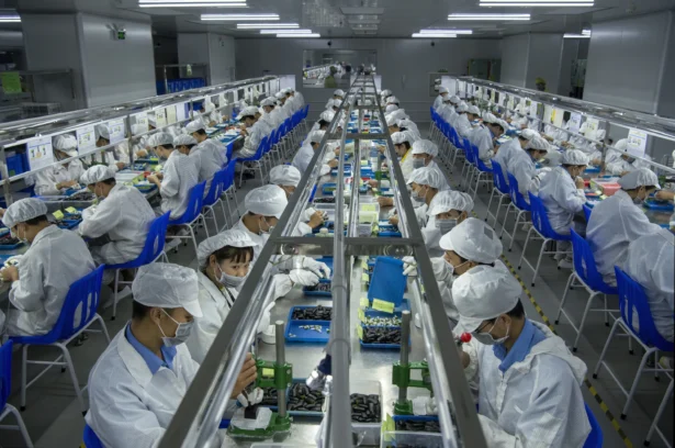 Workers make e-cigarette pods on the production line at KangerTech in Shenzhen, China, on Sept. 24, 2019. (Kevin Frayer via Getty Images)