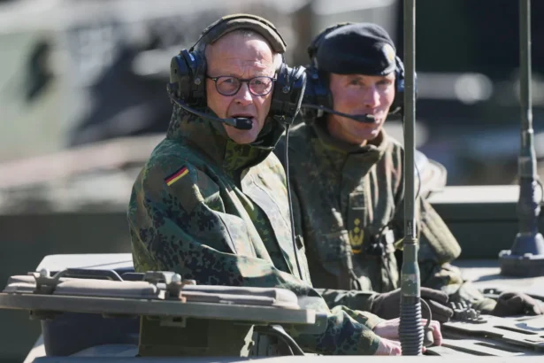 German Chancellor Friedrich Merz drives in the Boxer armoured fighting vehicle during his visit to the army at the Bundeswehr base in Munster, Germany, on April, 30, 2026. (Markus Schreiber/AP Photo/Pool)