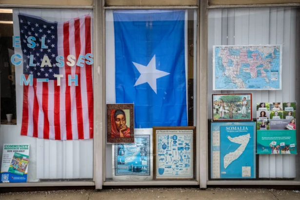 The front window of the Somali Community Association of Ohio, displaying the flags of the United States and Somalia, in Columbus, Ohio, on Jan. 6, 2026. (Glenn Hartong for The Epoch Times)