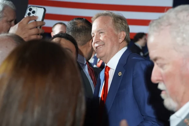 Texas Attorney General Ken Paxton takes photographs with supporters in Dallas, Texas, on March 3, 2026. (Nathan Worcester/The Epoch Times)