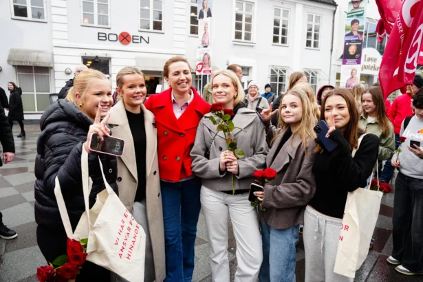Denmark’s Prime Minister and the leader of the Social Democrats, Mette Frederiksen (3rd L), poses with young women during the parliamentary election on the street at Nytorv in Aalborg, Denmark, on March 24, 2026. (Henning Bagger/Ritzau Scanpix/AFP via Getty Images/Denmark OUT)