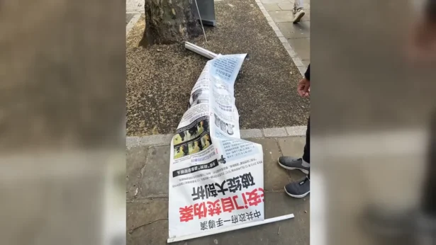 A destroyed banner after a Falun Gong information booth was targeted outside the British Museum in London on June 4, 2026. (Courtesy of John Zhang)