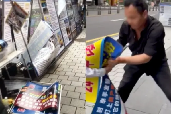 A Mandarin-speaking Chinese man vandalizes Falun Gong practitioners' information stands in Jeju, South Korea, on June 2, 2026. (Courtesy of Falun Gong practitioners in Jeju)