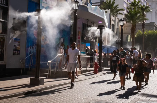 People walk near stores during high temperatures in Las Vegas, on July 10, 2026. (John Fredricks/The Epoch Times)