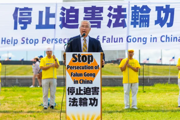Wang Zhiyuan, chairman of the World Organization to Investigate the Persecution of Falun Gong, speaks at a rally calling for an end to the persecution of Falun Gong, in Washington on July 19, 2018. (Mark Zou/Epoch Times)