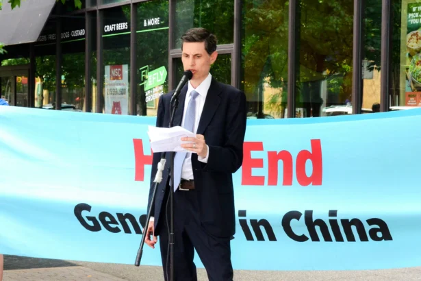 Dr. Alejandro Centurion, associate director of medical affairs at DAFOH, speaks at a rally outside the American Transplant Congress 2024 in Philadelphia on June 2, 2024. (Frank Liang/The Epoch Times)