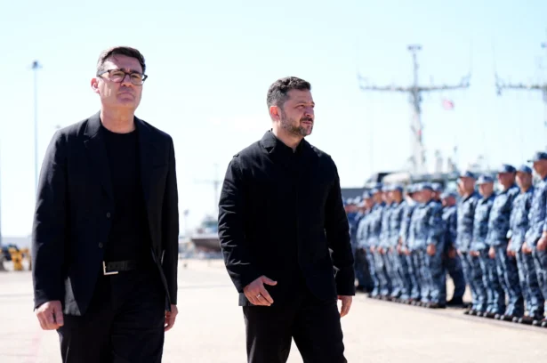 British Prime Minister Andy Burnham (L) walks with Ukraine's President Volodymyr Zelenskyy (R) at a naval base in Portsmouth, England, on July 27, 2026. (Aaron Chown/AFP/Getty Images)