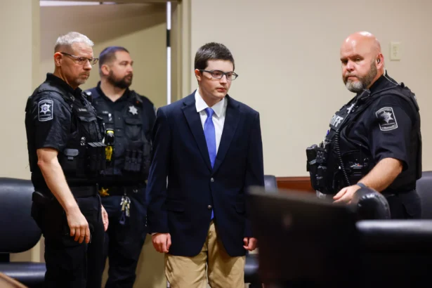 Colt Gray, the 16-year-old Apalachee High School shooting suspect, is led in by deputies for a plea hearing at Barrow County Superior Court in Winder, Ga., on July 24, 2026. (Arvin Temkar/Atlanta Journal-Constitution via AP)
