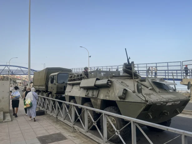 Spanish Army vehicles and soldiers deploy along the coastal road on Avenida Martínez Catena in the Spanish territory of Ceuta, on July 31, 2026, as part of the response to the migrant crisis. (Etienne Fauchaire/The Epoch Times)