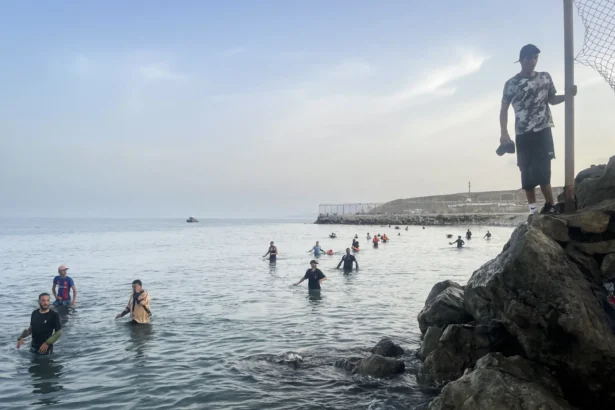Moroccan migrants continue swimming across the sea border into Ceuta, July 31, 2026, as arrivals persist. (Etienne Fauchaire/The Epoch Times)
